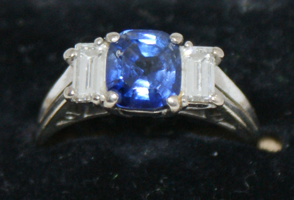 An 18ct white gold mounted sapphire and diamond set ring,