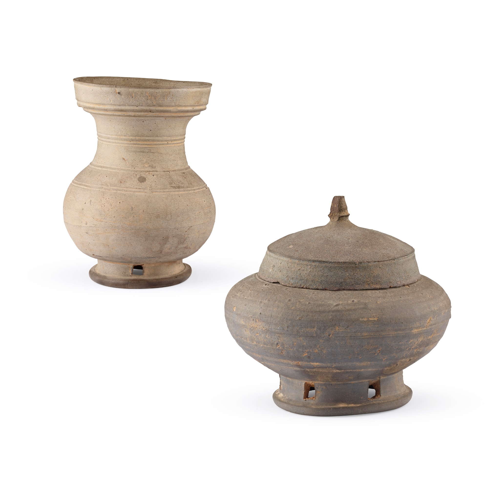 TWO POTTERY JARS WITH PIERCED FOOT
