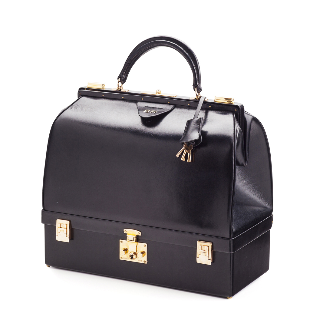 HERMES - A black leather 'Sac Malette' jewellery bag