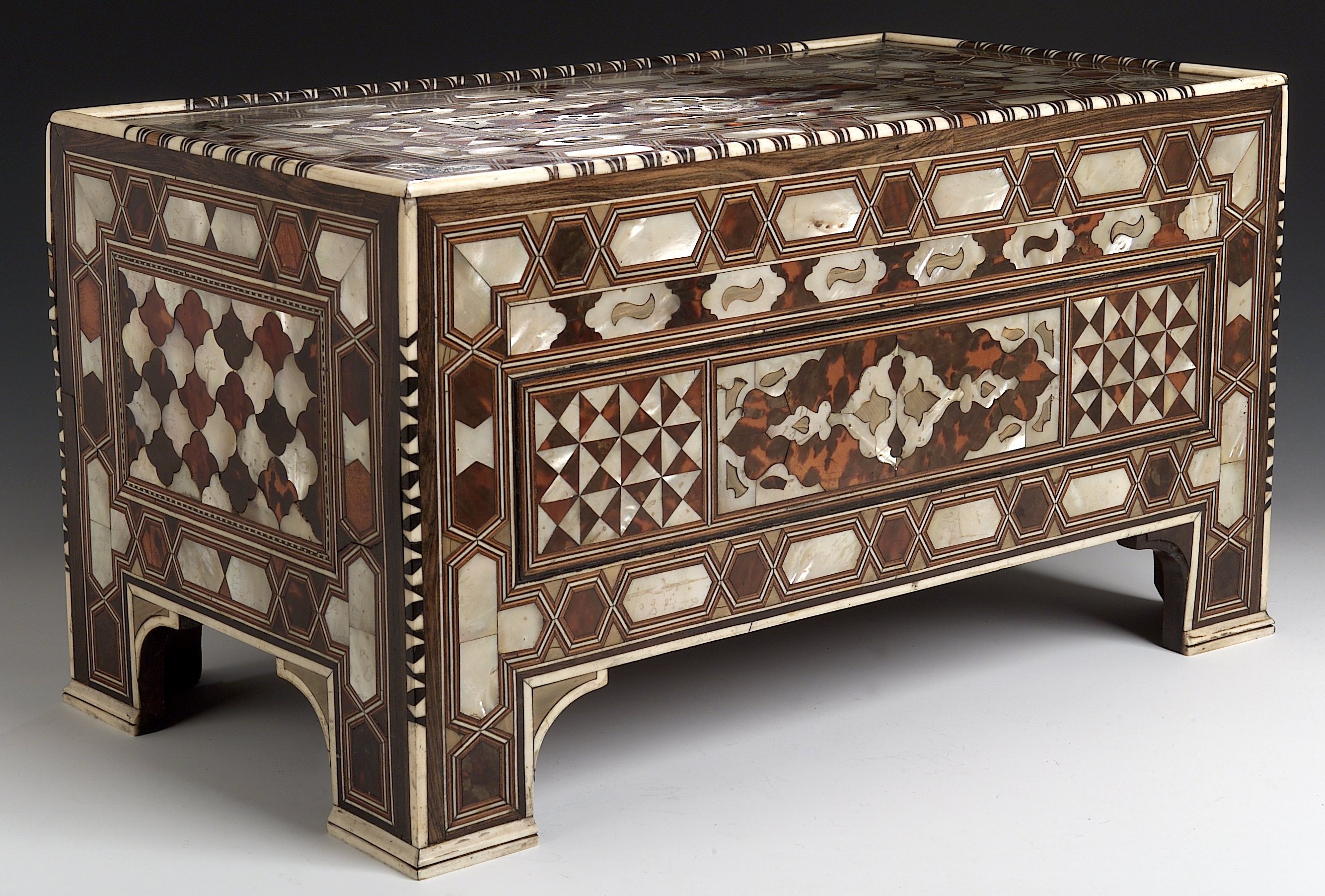 A Middle Eastern rosewood, ivory, tortoiseshell and mother of pearl box