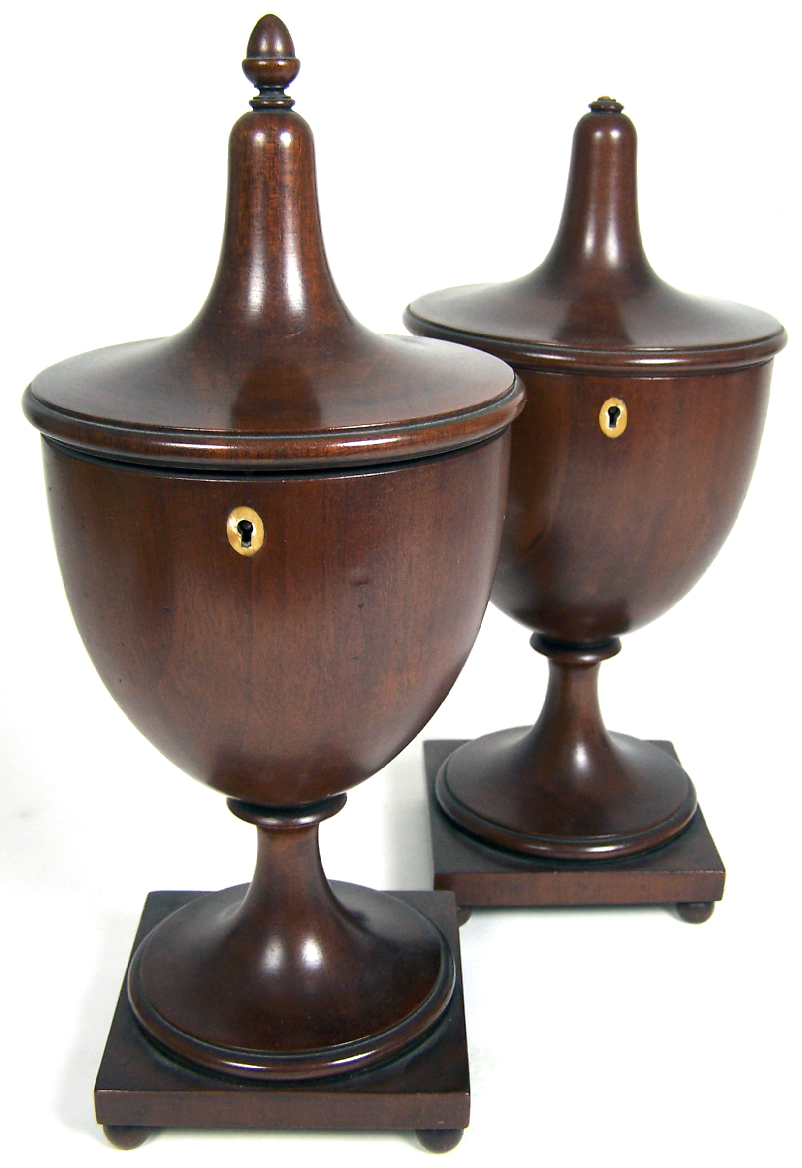 A pair of Regency style mahogany urn tea caddies