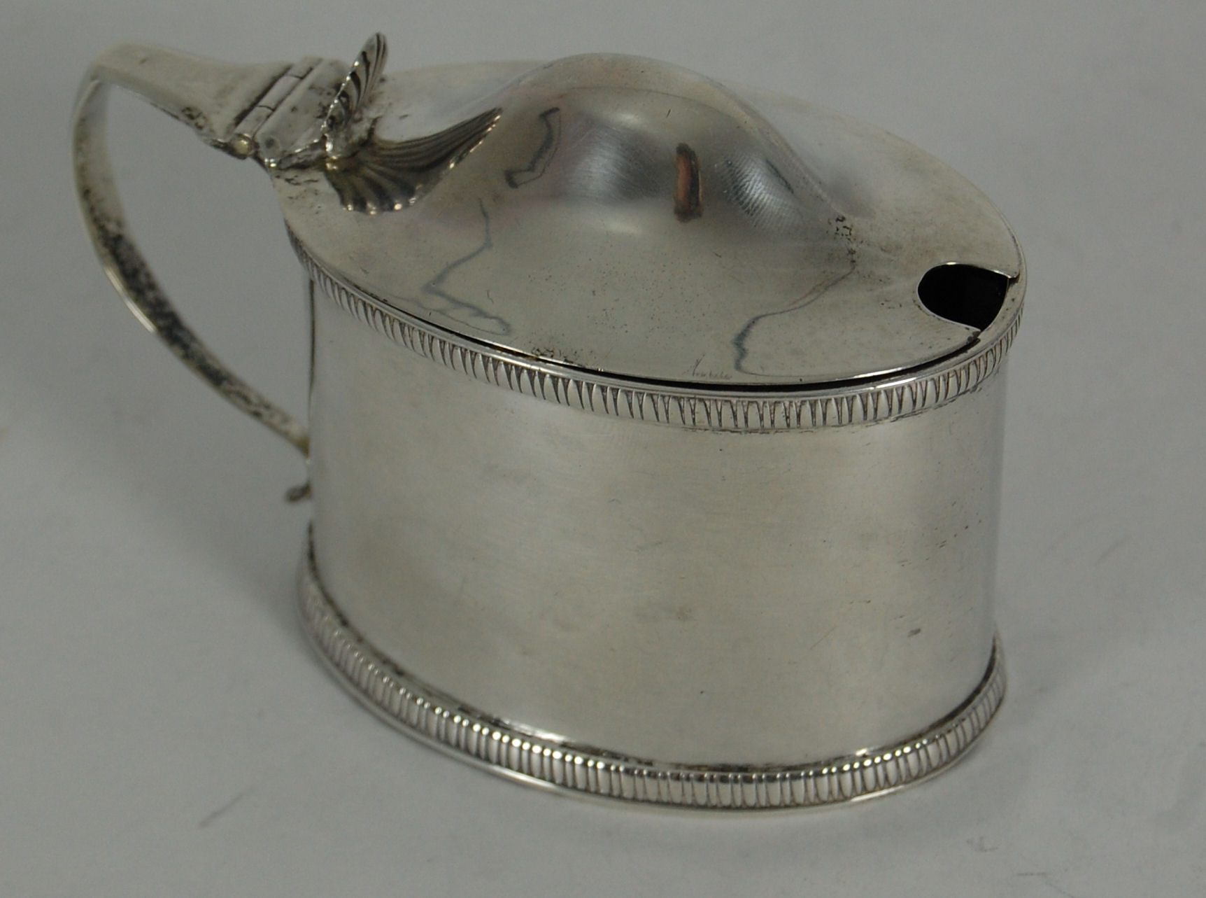 A George III mustard pot and cover