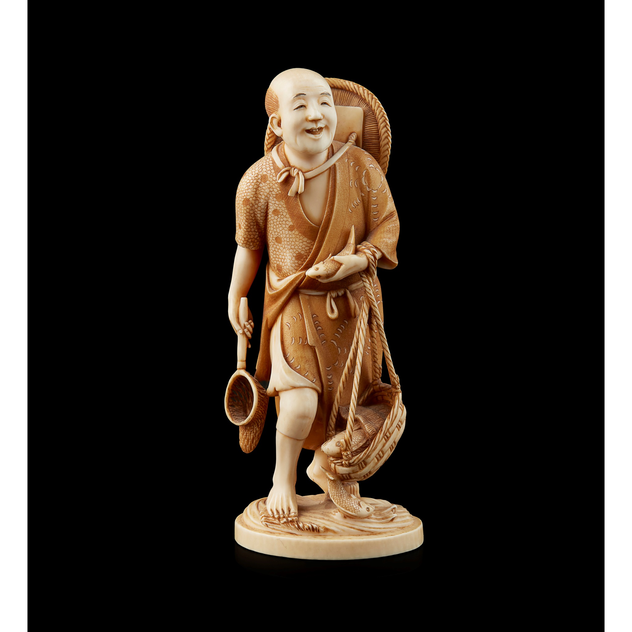 FINE JAPANESE IVORY OKIMONO OF A FISHERMAN