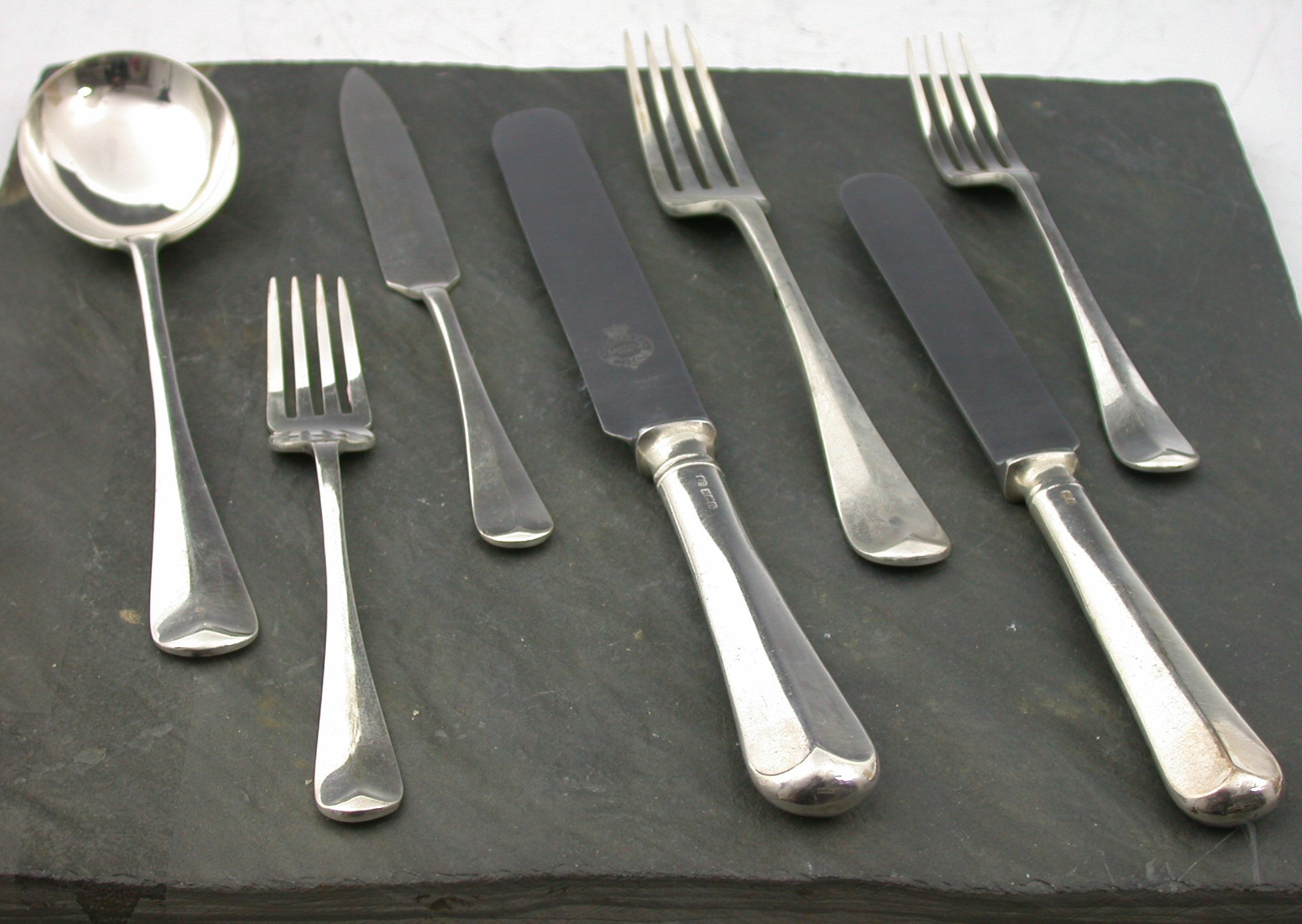 A canteen of rat tail pattern flatware and cutlery,