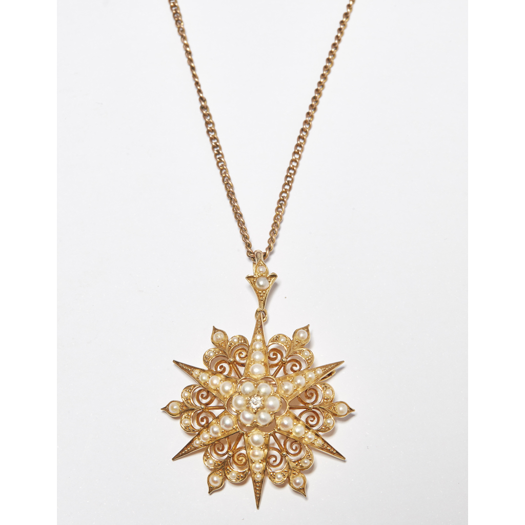 A late Victorian seed pearl and diamond set pendant
