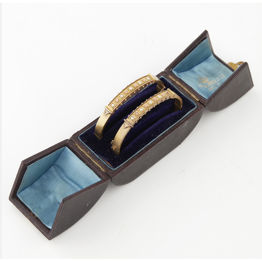 A pair of pearl and coral set bangles