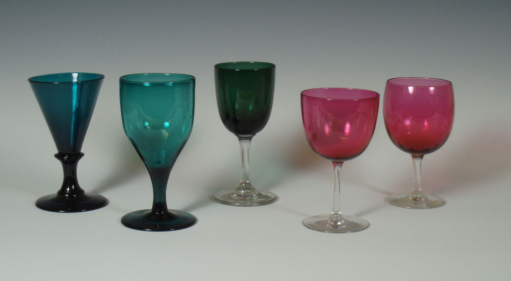 A group of 19th century and later green and cranberry drinking glasses