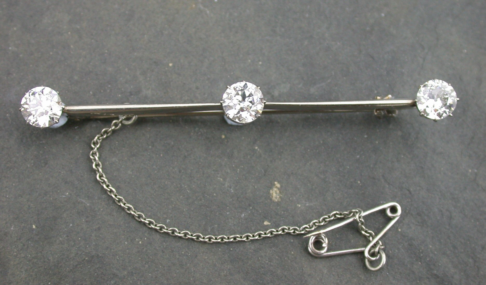An early 20th century diamond bar brooch,