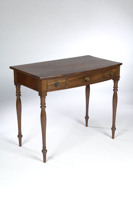 A Regency mahogany bowfront serving table