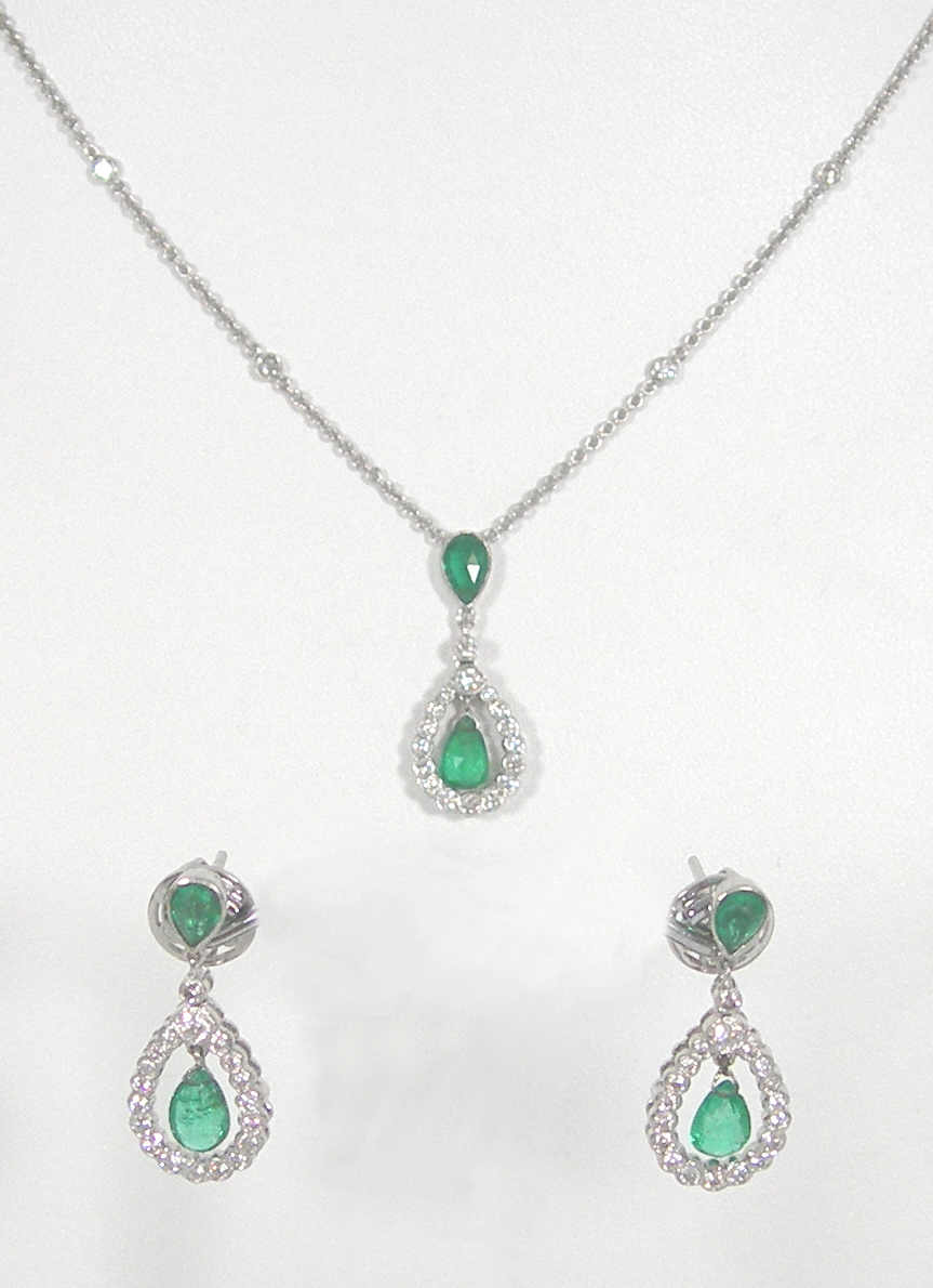 An emerald and diamond set suite,