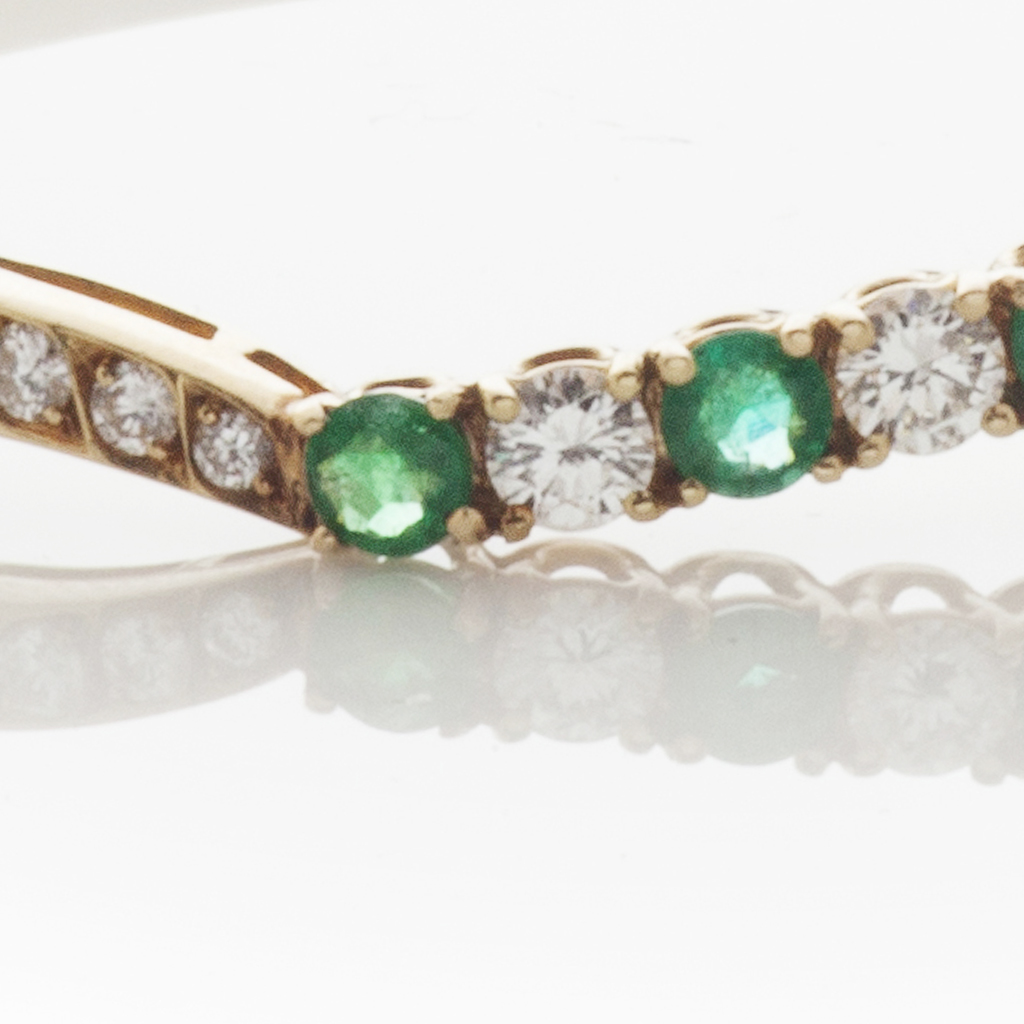 An emerald and diamond set bangle