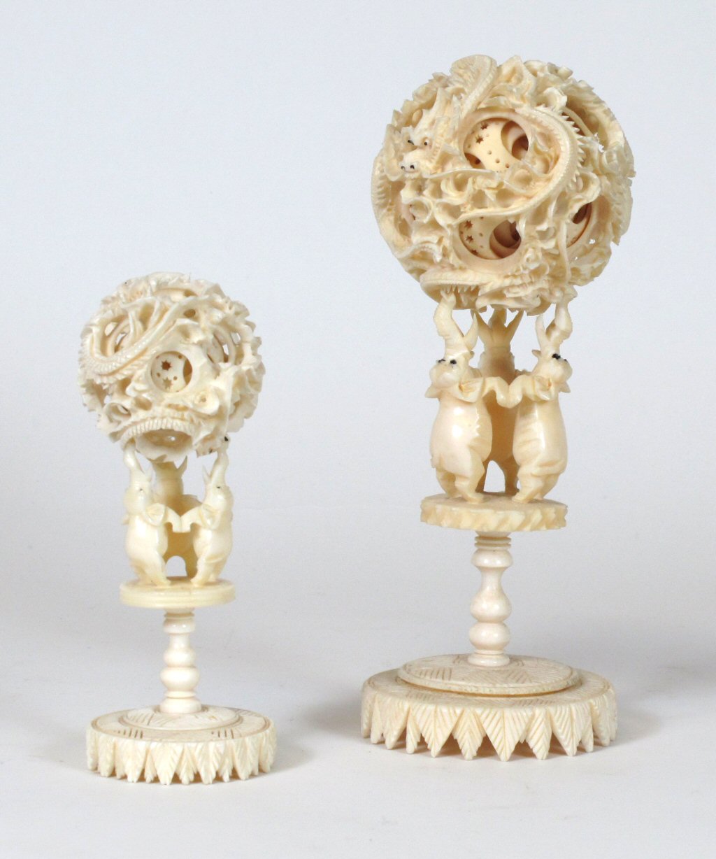 TWO GRADUATED IVORY PUZZLE BALLS