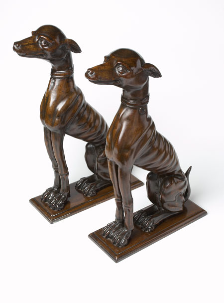 A pair of late 18th century mahogany figures of Venetian hounds