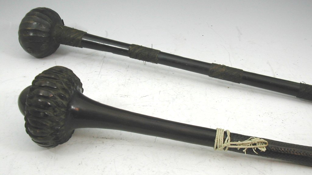 A South Sea island polished hardwood war club made from the crown of a palm tree,