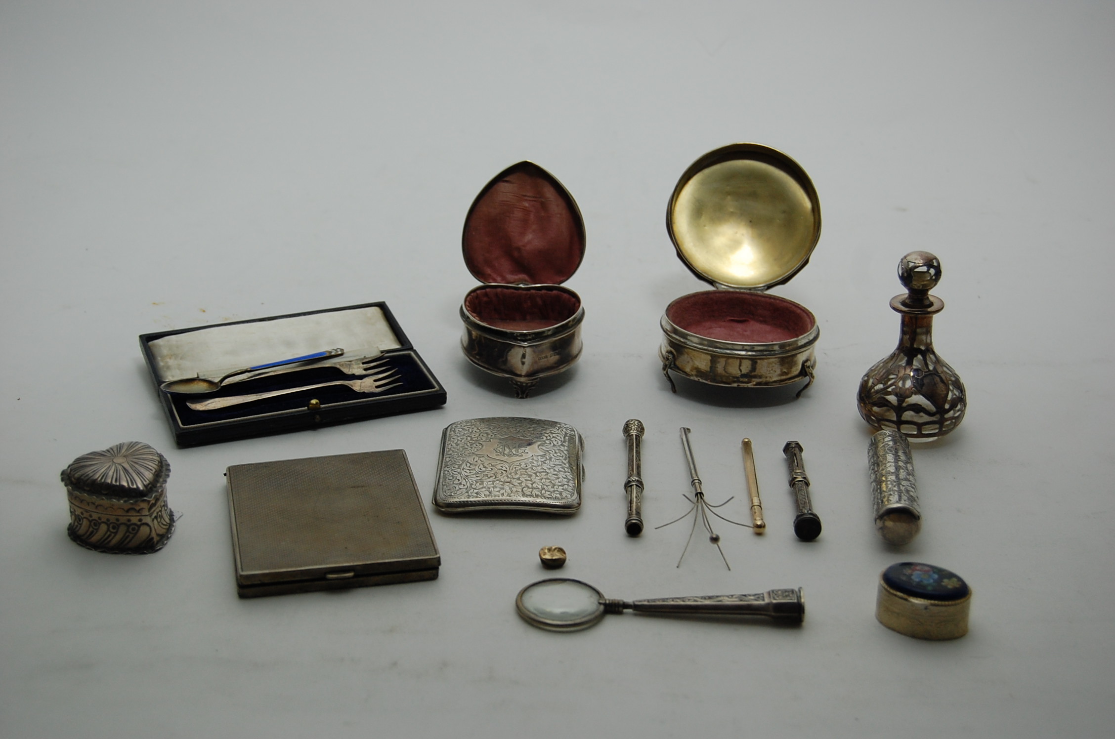 A group of silver dressing table boxes and other items to include