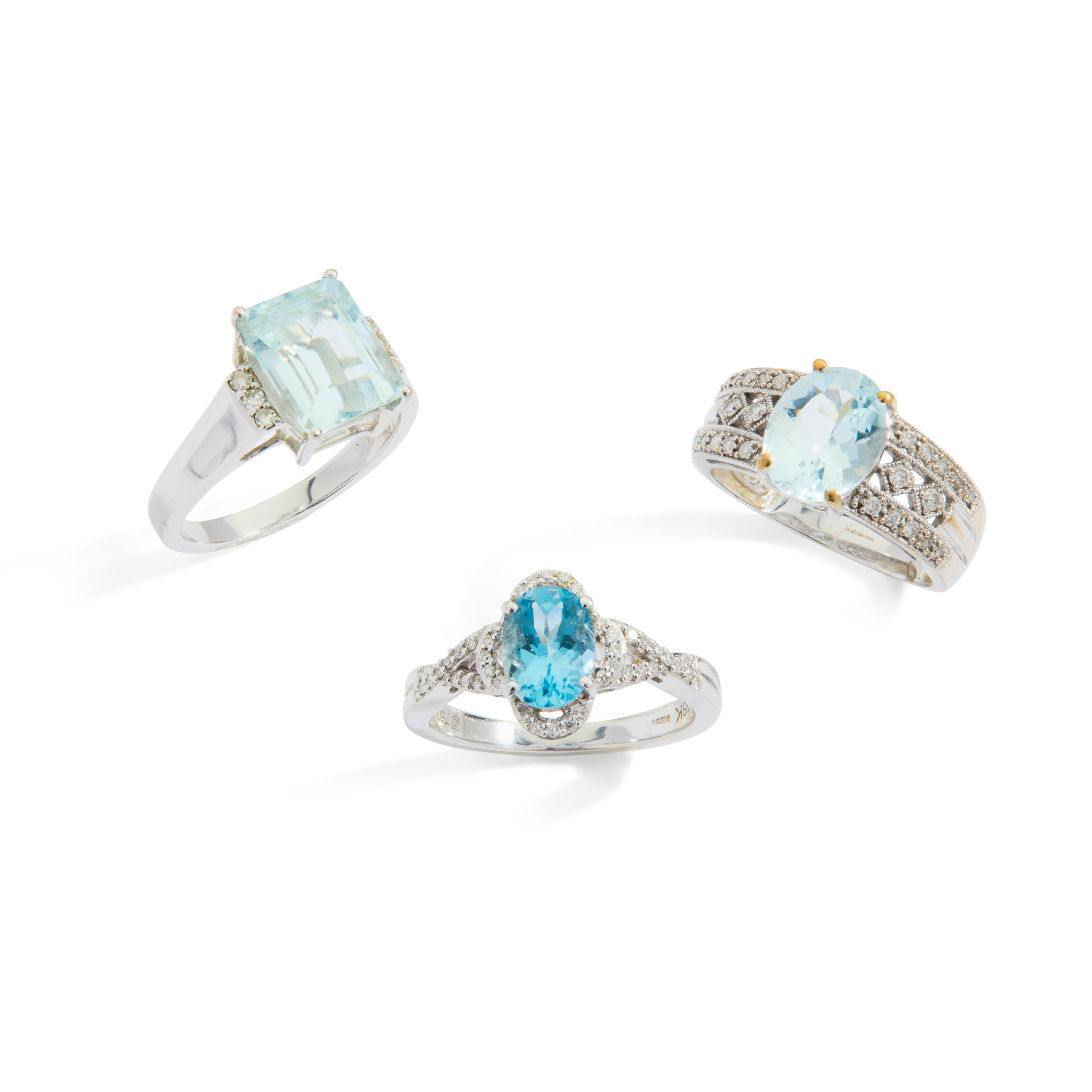Three aquamarine and diamond cluster rings