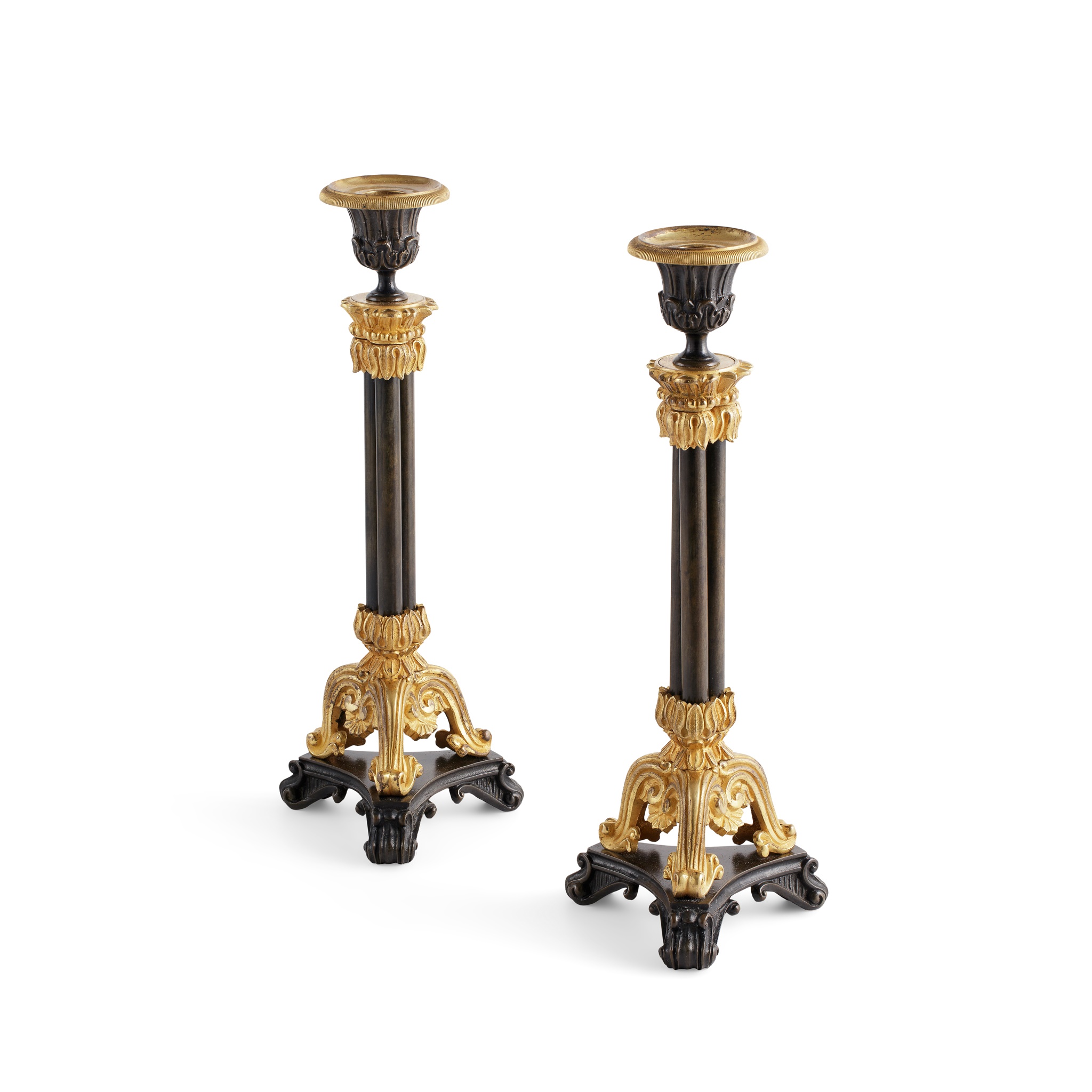 PAIR OF REGENCY PATINATED AND GILT BRONZE CANDLESTICKS