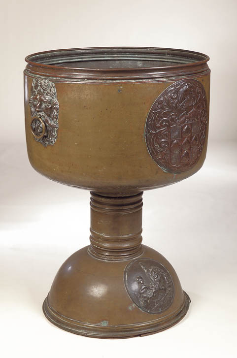 A massive brass and copper wine cooler,