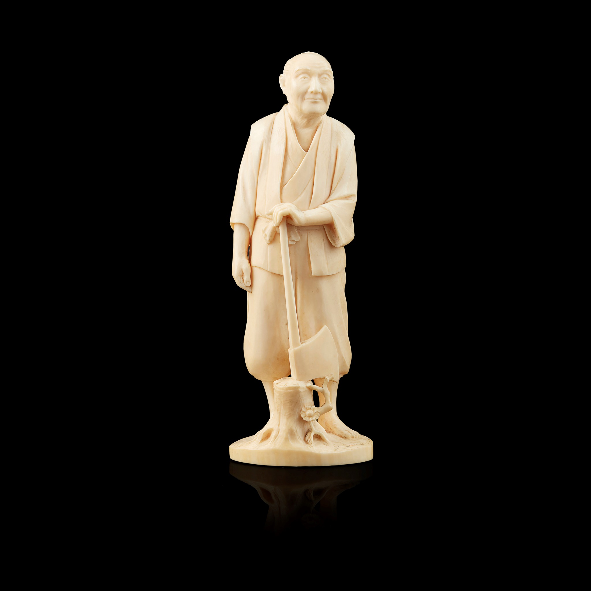 IVORY OKIMONO OF A WOODSMAN