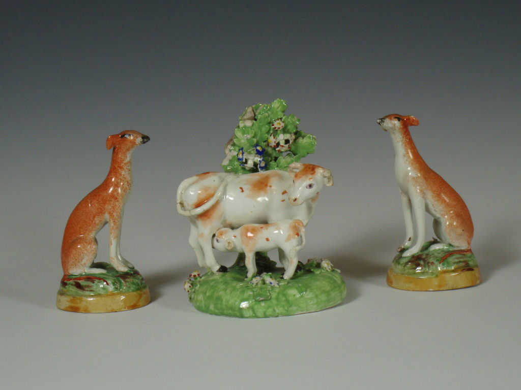 A late 18th century Chelsea Derby figure of a cow and calf