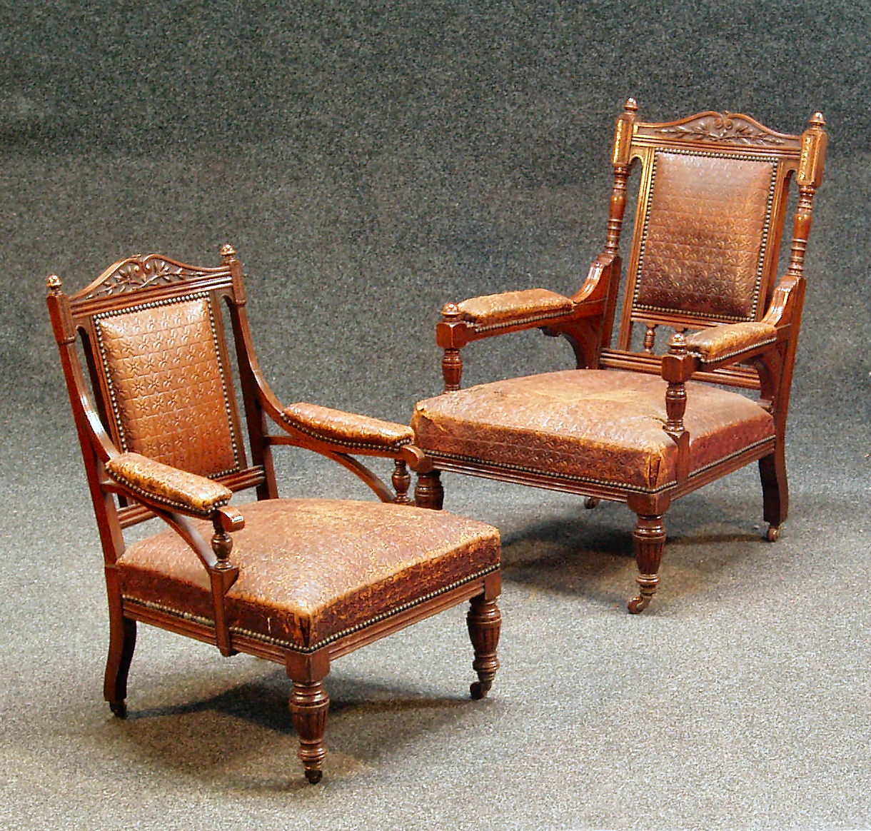 A pair of Aesthetic movement oak easy armchairs,