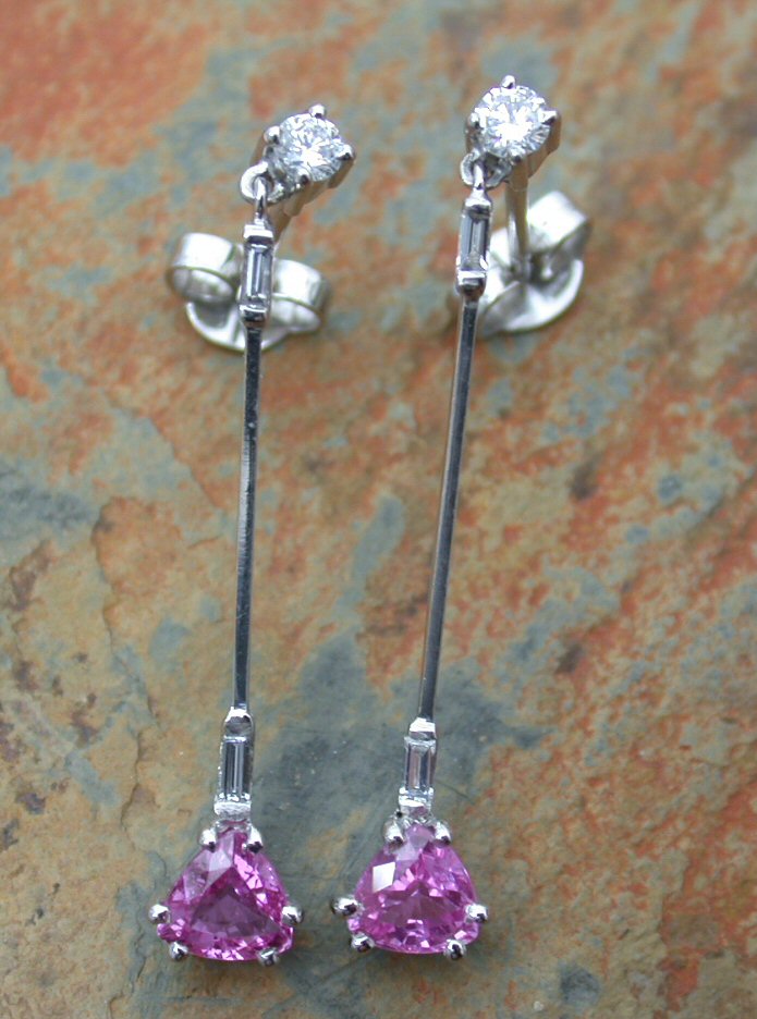 A pair of pink sapphire and diamond pendant earrings,