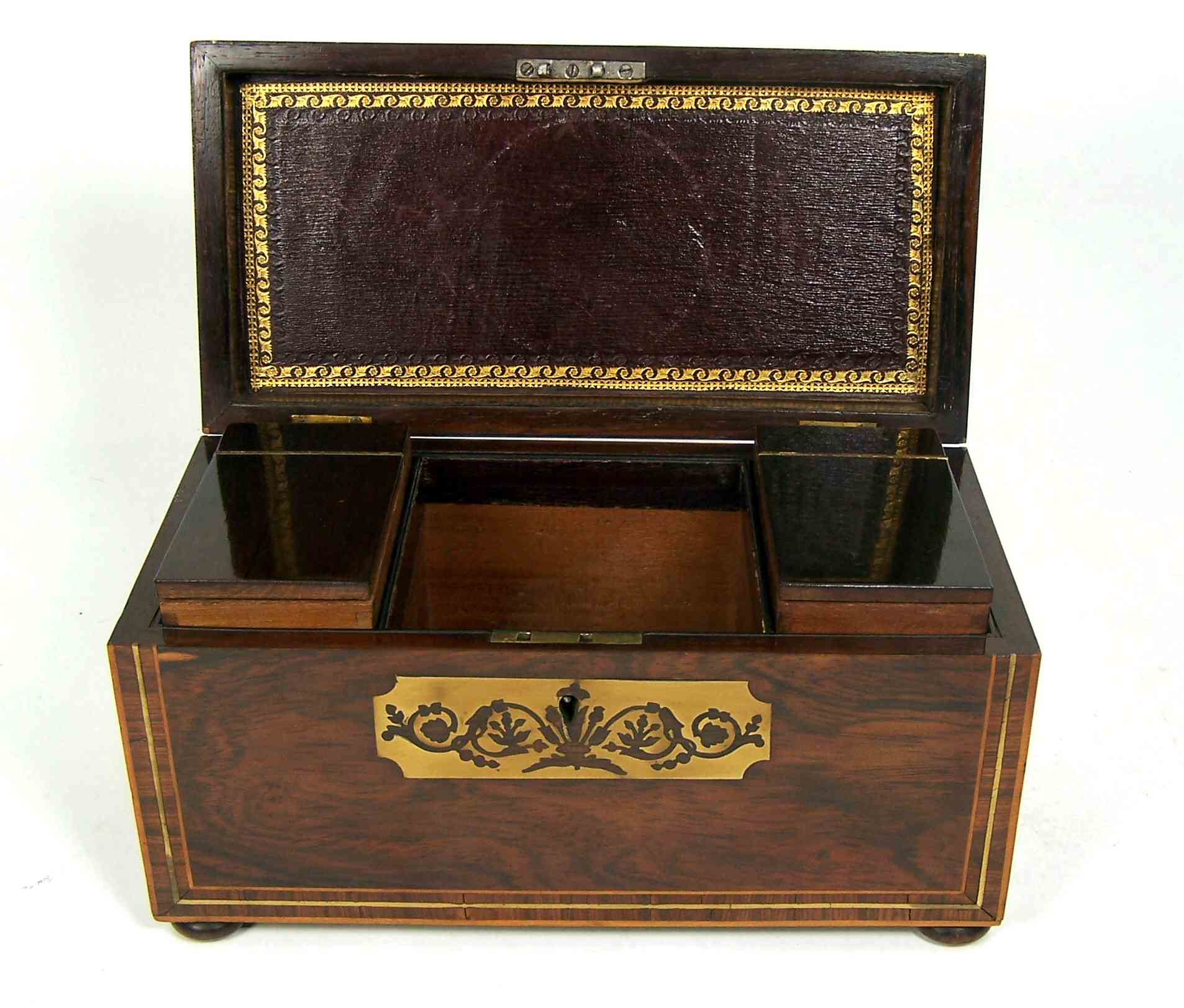 A Regency period rosewood and brass inlaid tea caddy