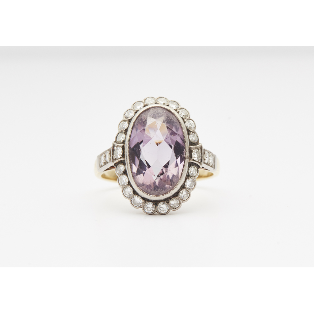 An amethyst and diamond set cocktail ring