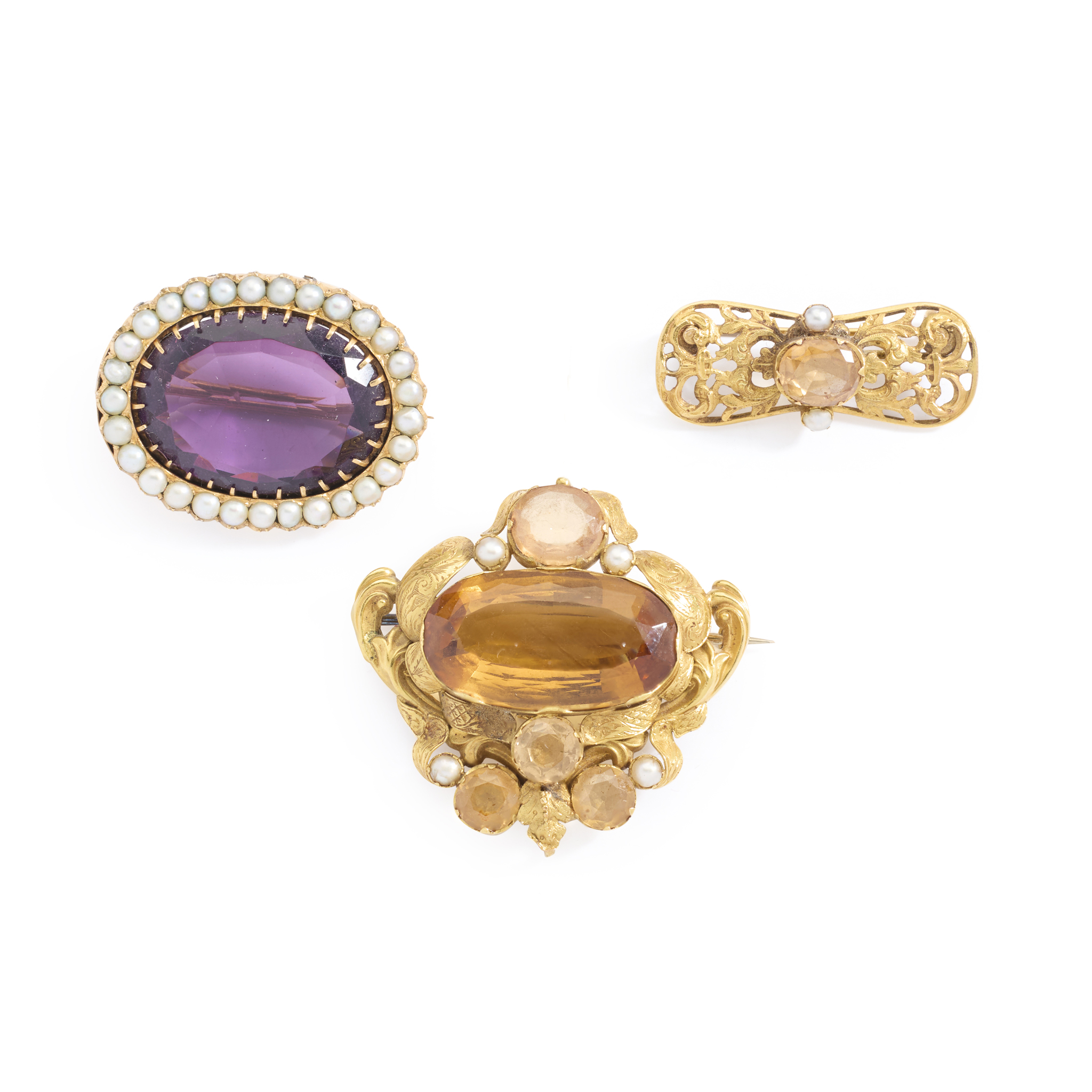 A collection of gem-set brooches
