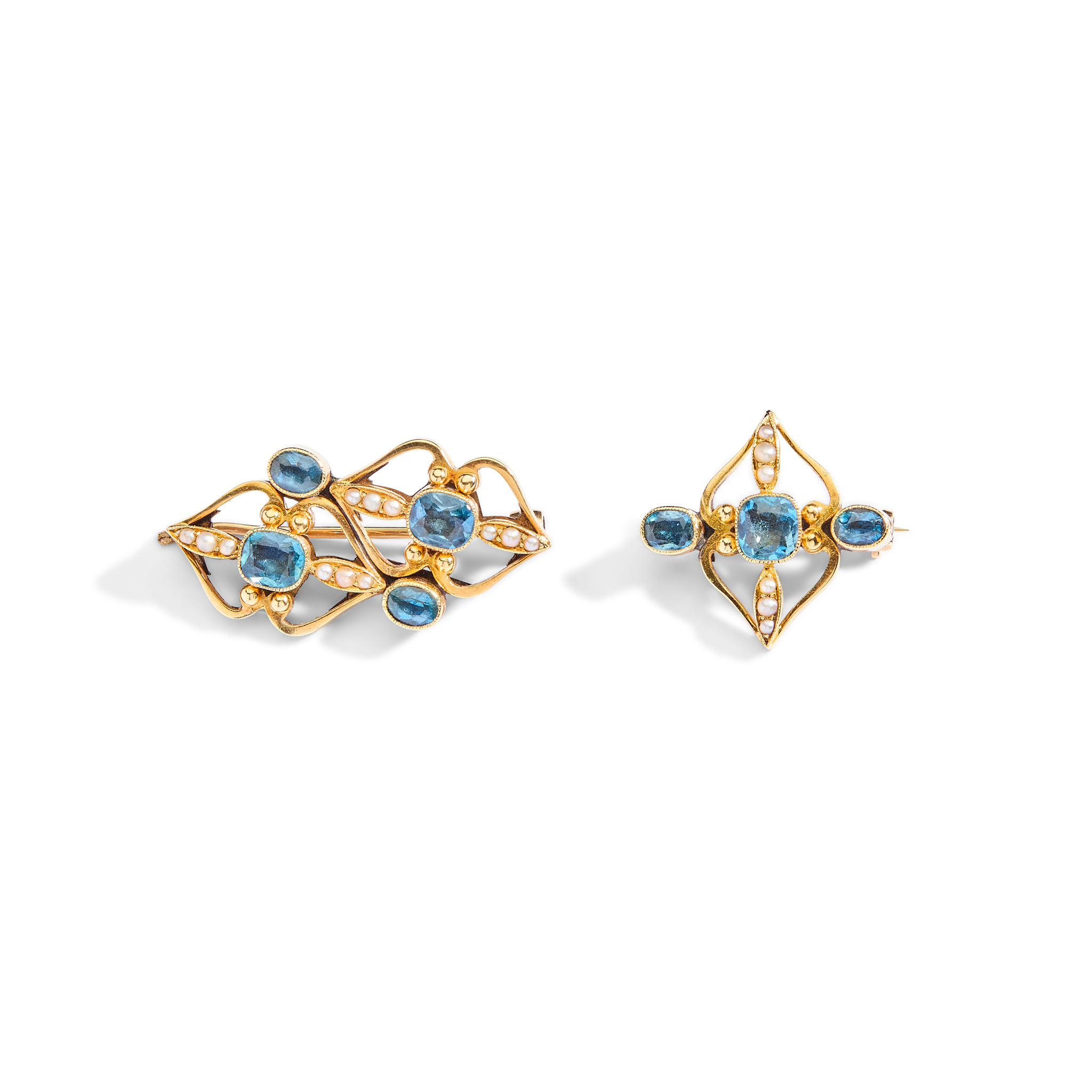 Two blue topaz and seed pearl brooches