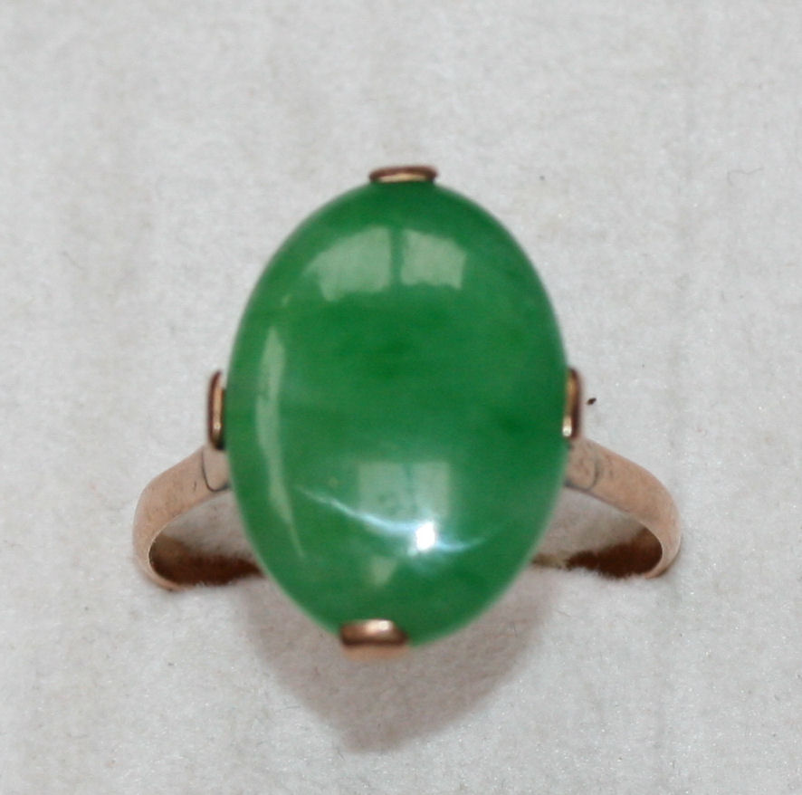 A jadeite cabochon set ring