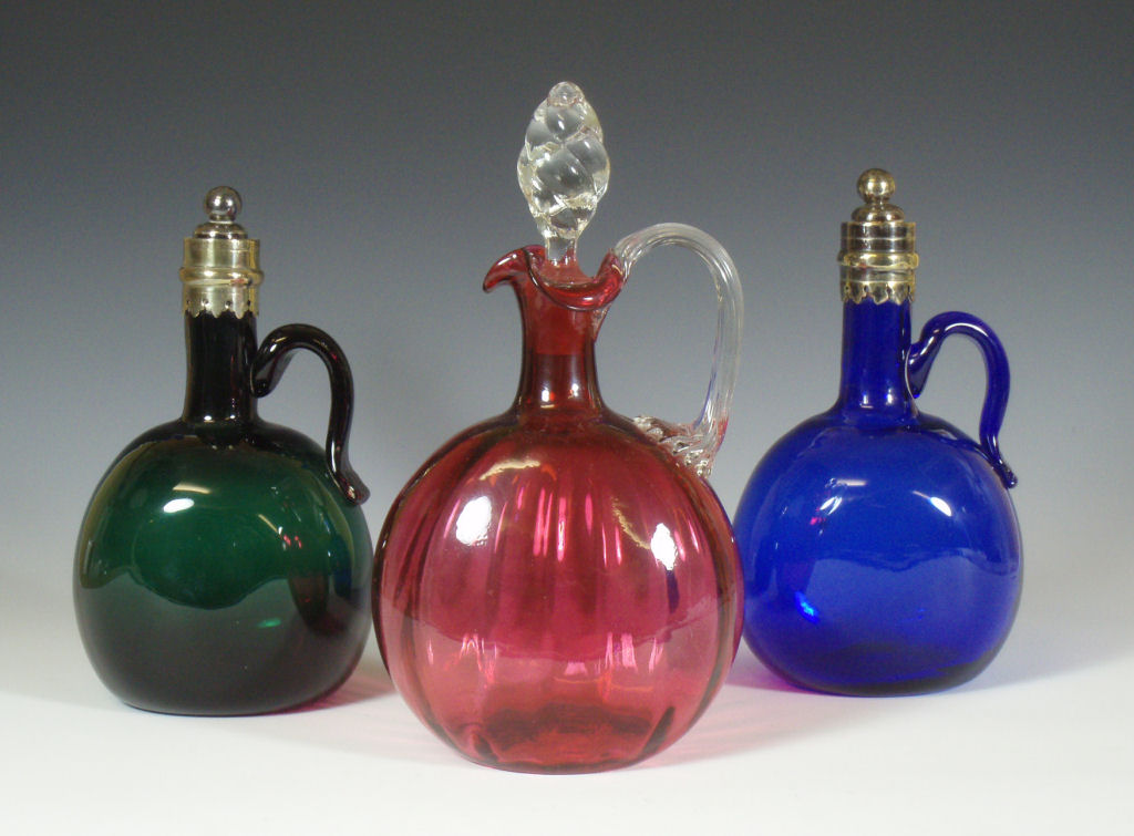 A group of three late 19th/early 20th century glass decanters