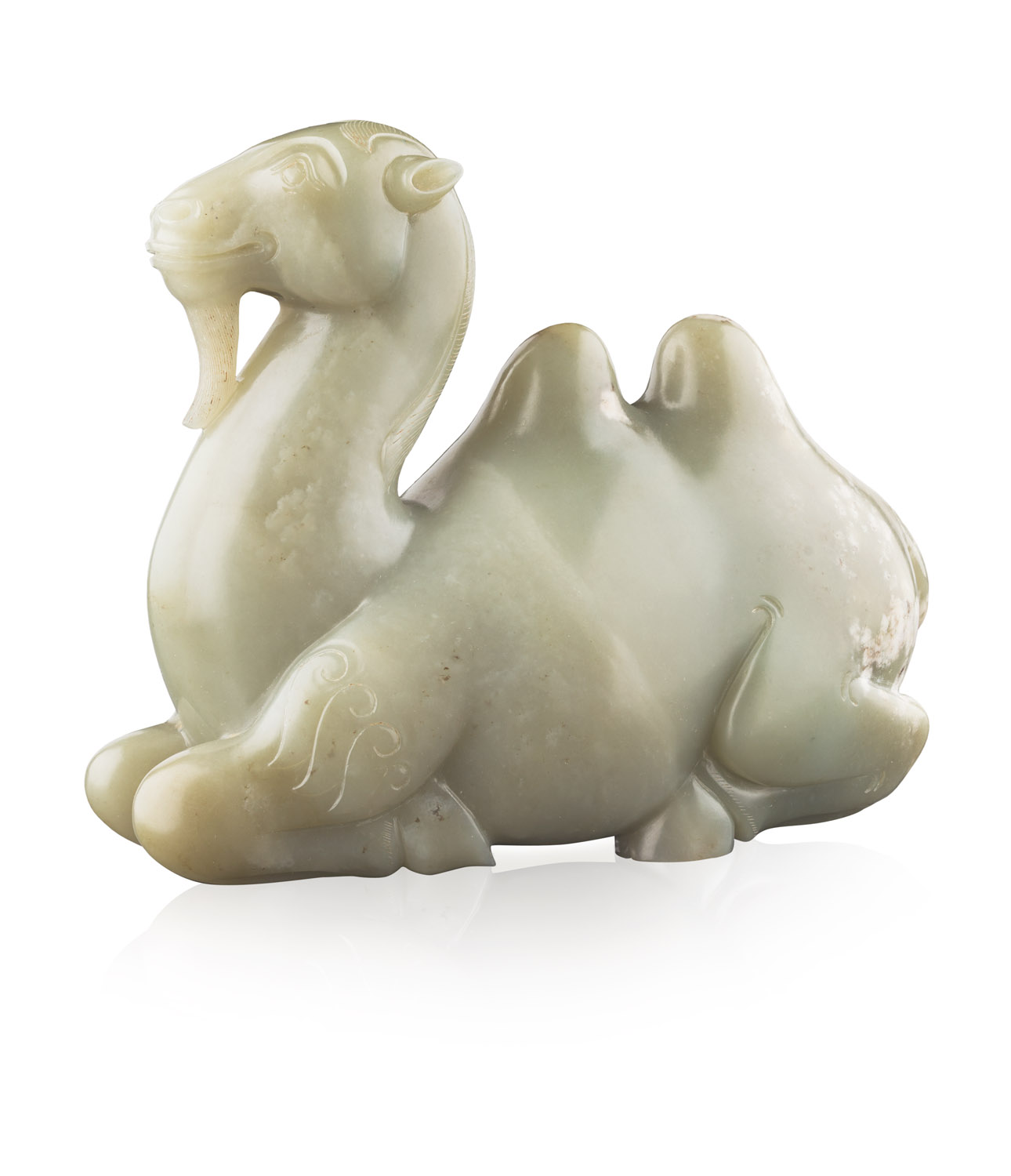 CARVED CELADON JADE OF A RECUMBENT CAMEL