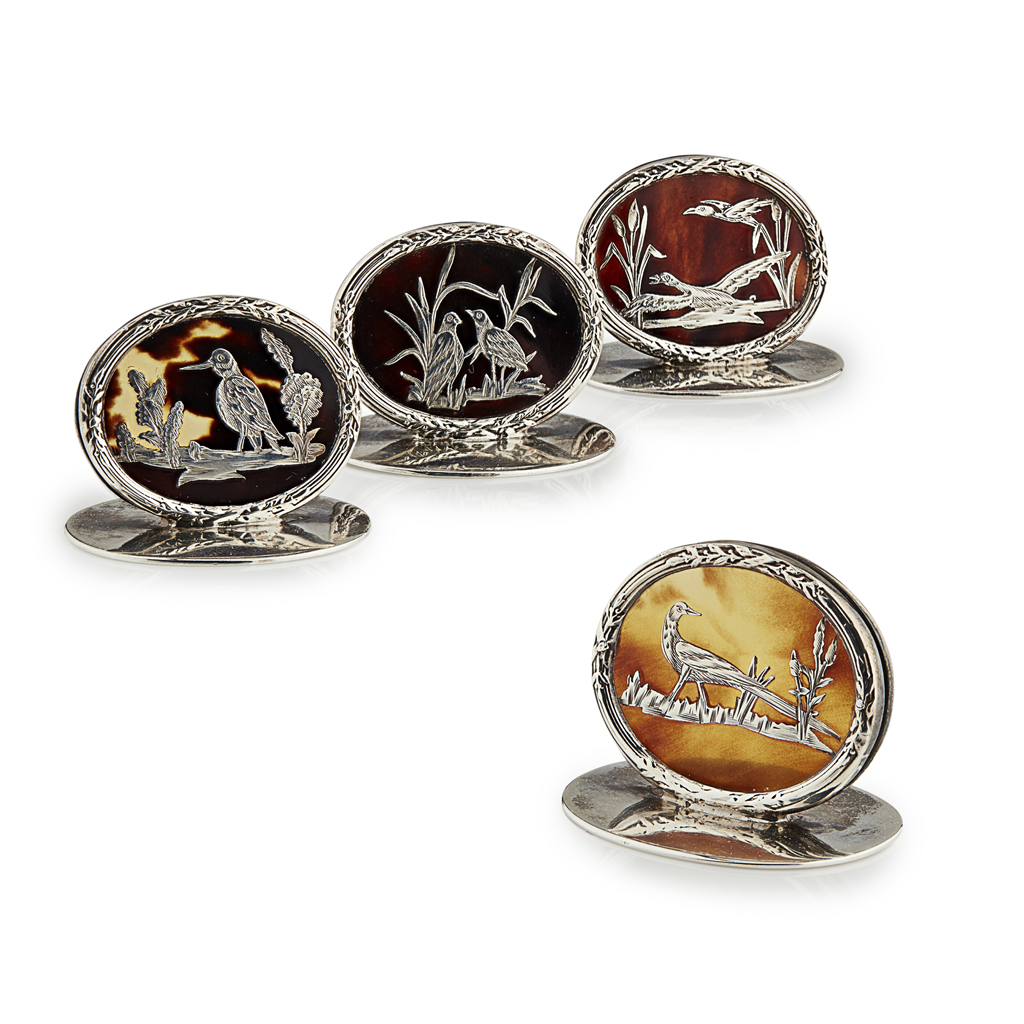 A cased set of four menu holders