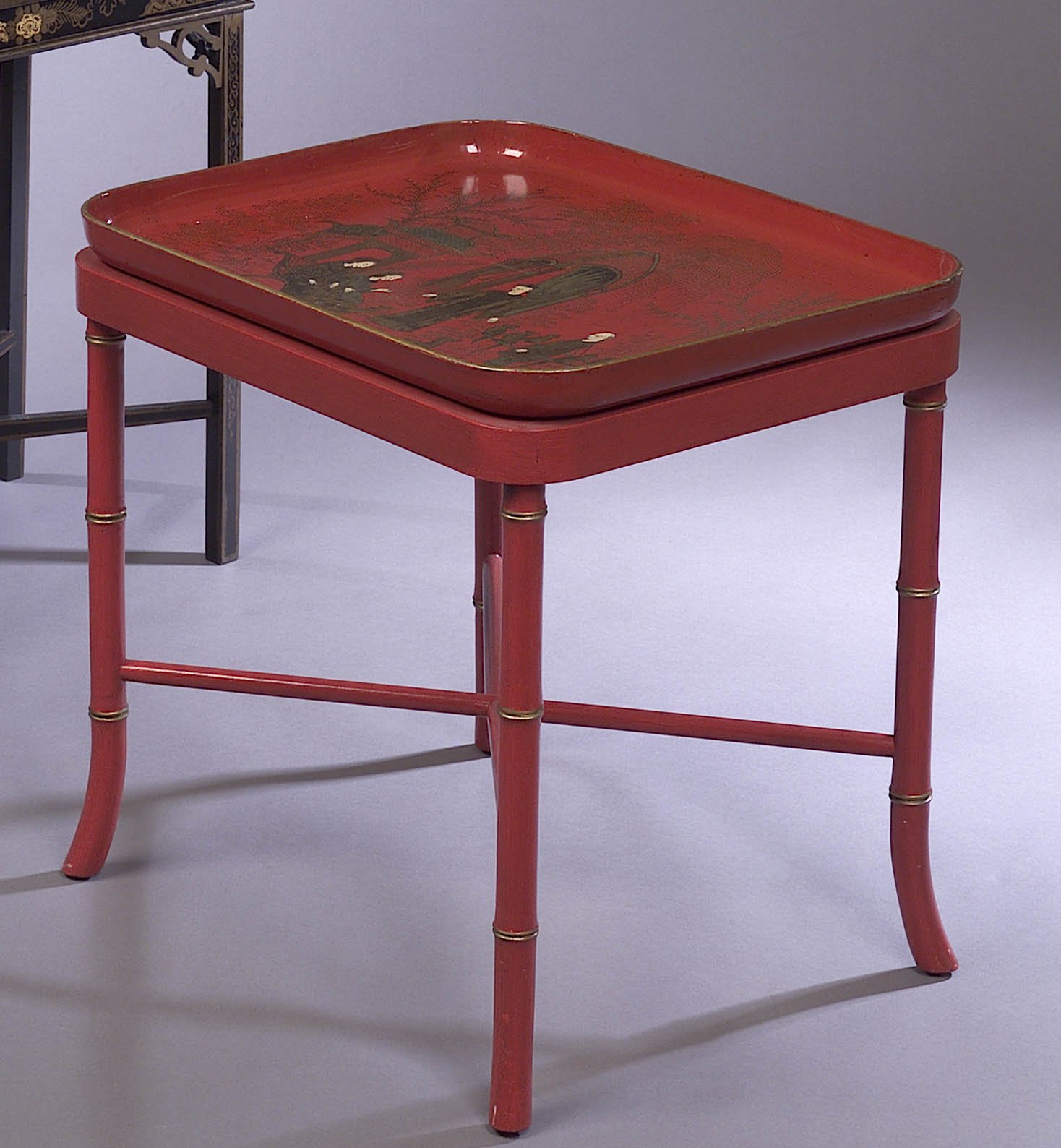A red lacquer tray on stand