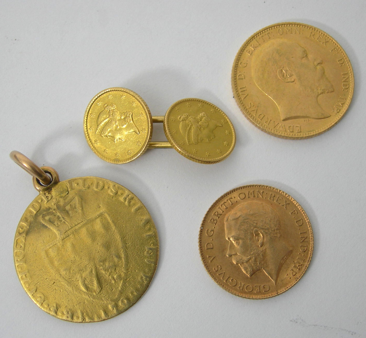 A cased set of six dress buttons