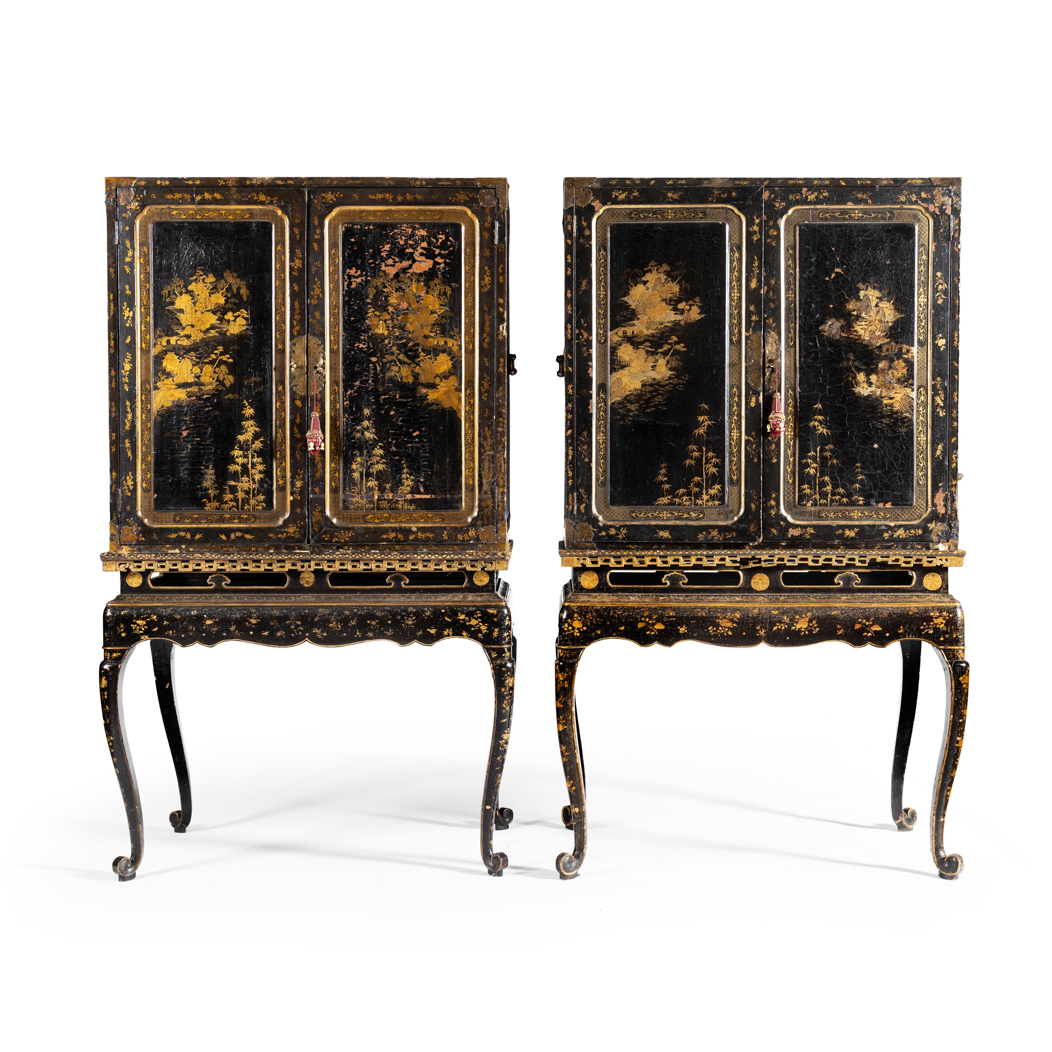 A MATCHED PAIR OF CHINESE BLACK LAQUER AND GILT PAINTED CABINETS ON STANDS