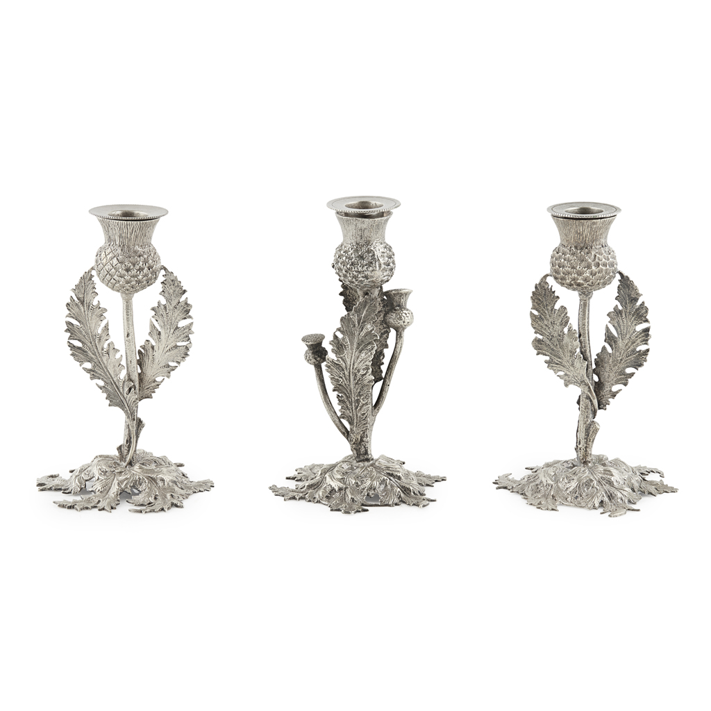 A SET OF THREE PEWTER CANDLESTICKS