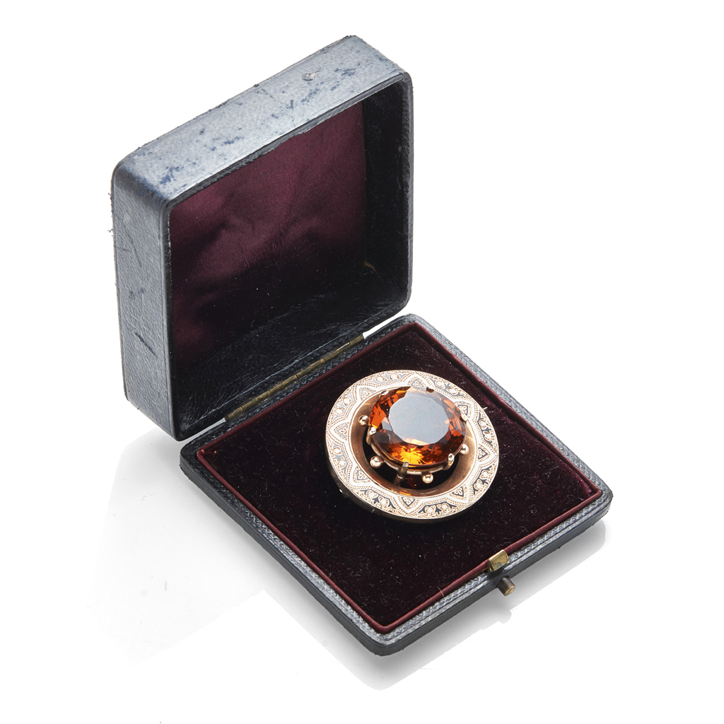 A Victorian enamel and citrine set brooch