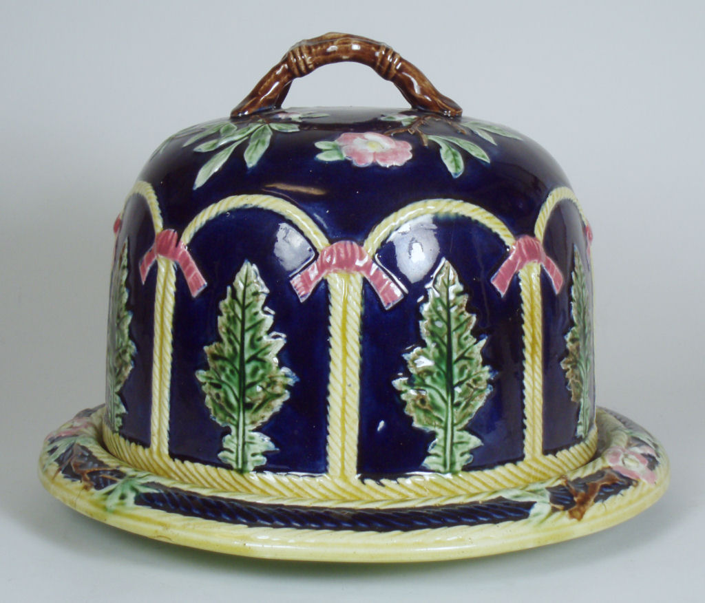 A Victorian majolica cheese cover and stand