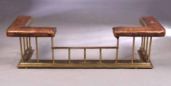 A 19th century brass club fender