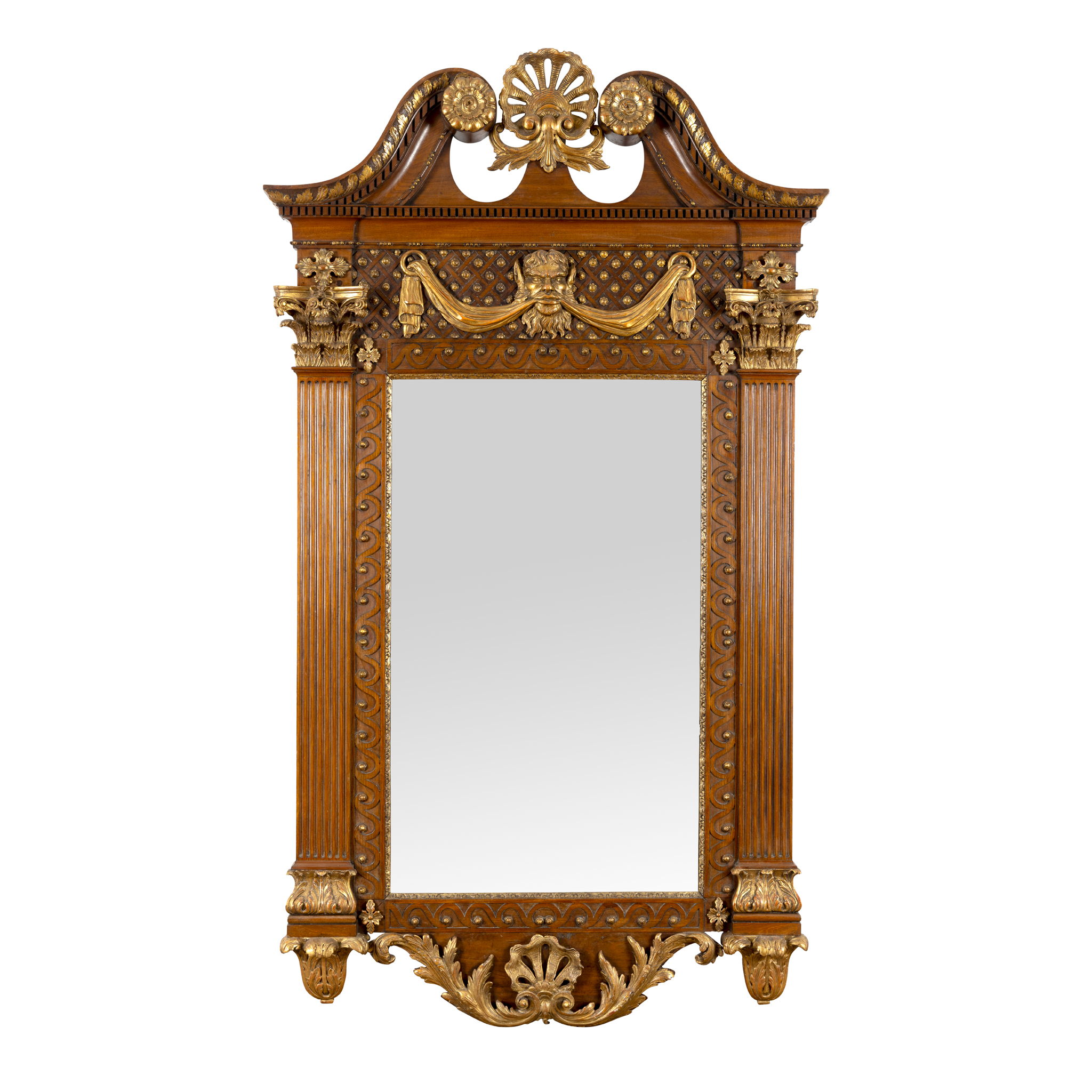 A MAHOGANY AND GILT DECORATED WALL MIRROR IN THE WILLIAM KENT MANNER