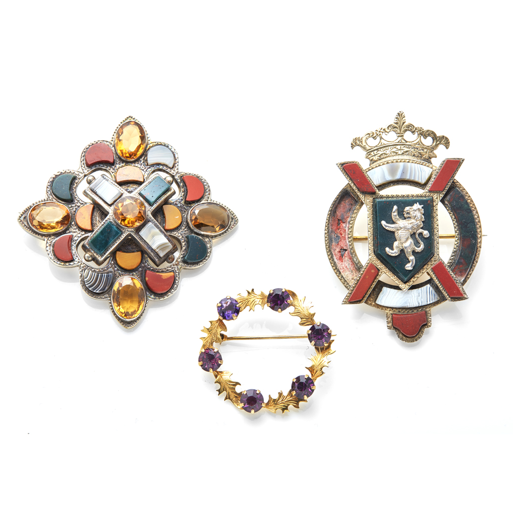 A collection of three agate and gem set brooches