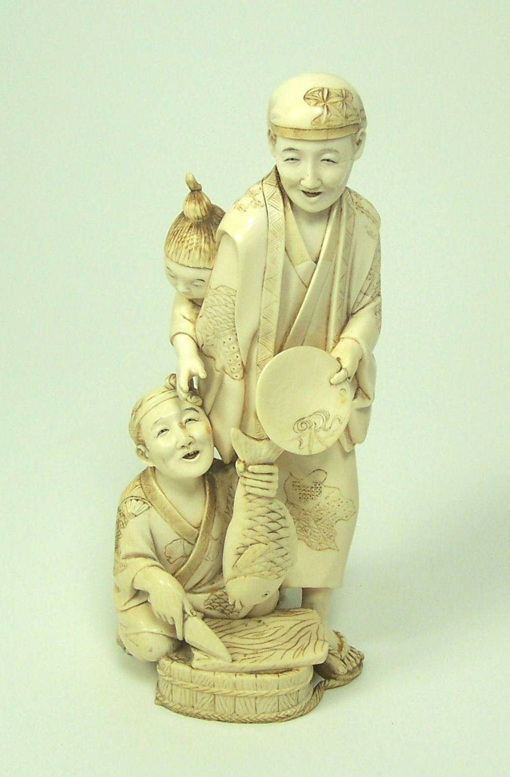 A Japanese ivory figure group, Meiji or Taisho period