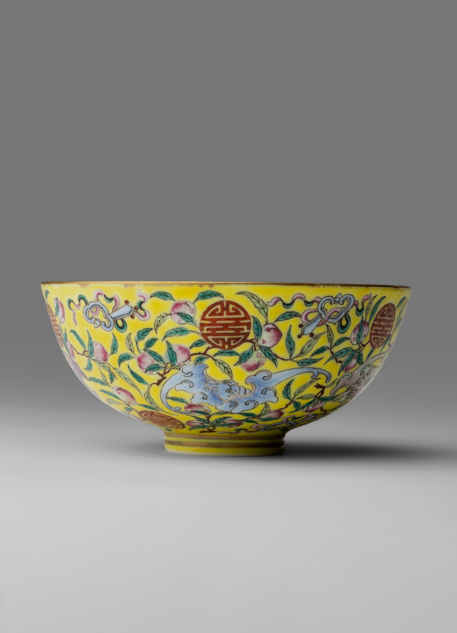 CHINESE YELLOW-GROUND FAMILLE ROSE 'BAT AND LONGEVITY' BOWL