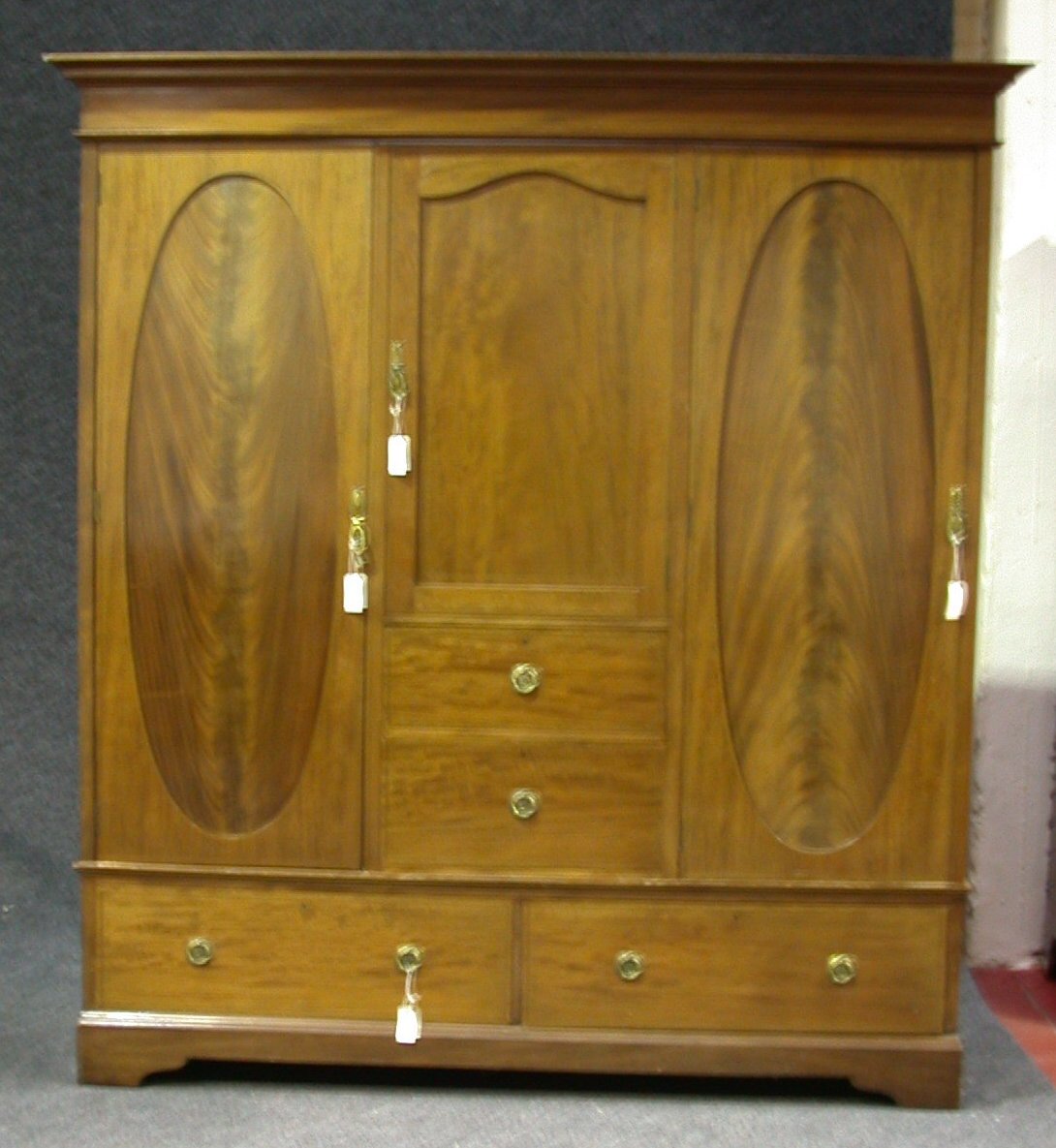 An Edwardian mahogany inlaid wardrobe,