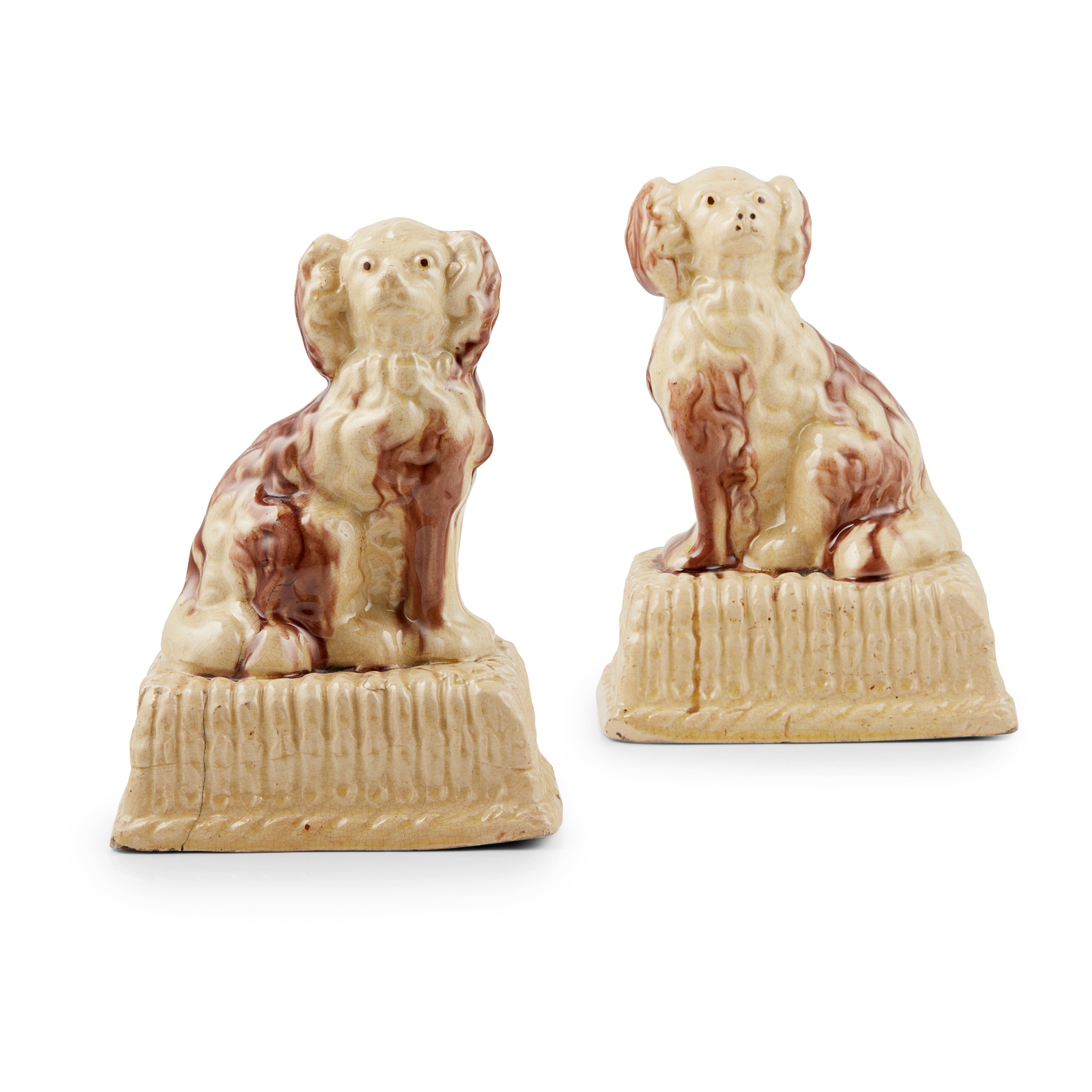 A PAIR OF SCOTTISH GLAZED POTTERY SPANIELS