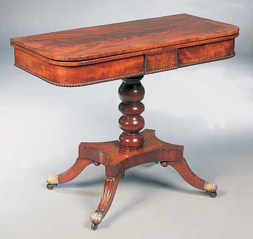 A Regency mahogany foldover card table