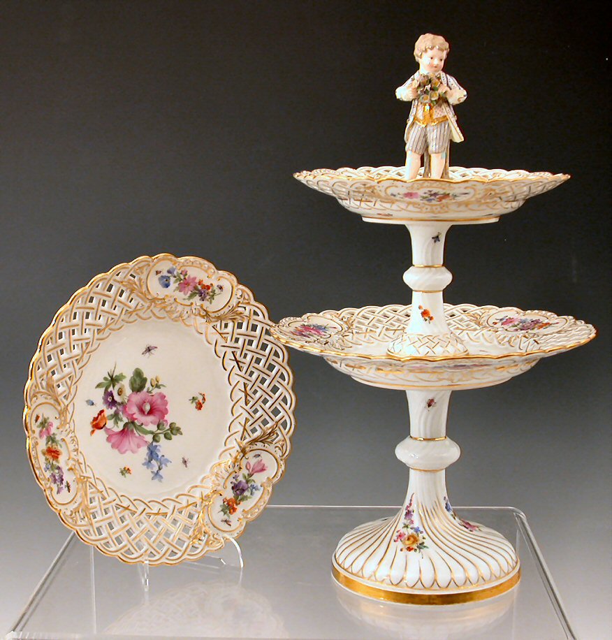 A Dresden floral and gilt painted two-tier table epergne