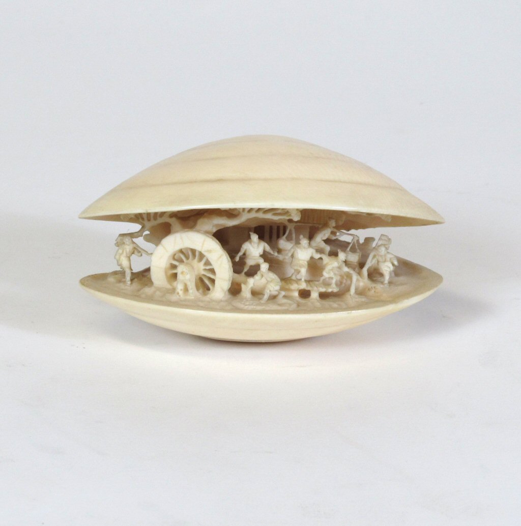 CHINESE CARVED IVORY PUZZLE BALL AND STAND